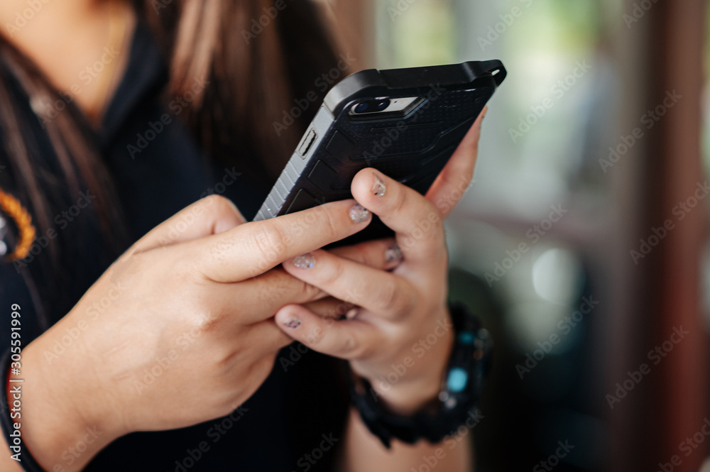 The girl sat using his mobile phone