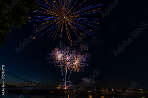 Fireworks light up on a dark sky background in France. © Serhii