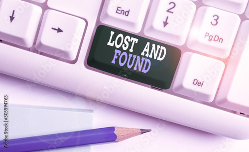 Text sign showing Lost And Found. Business photo showcasing Place where you can find forgotten things Search service White pc keyboard with empty note paper above white background key copy space photo