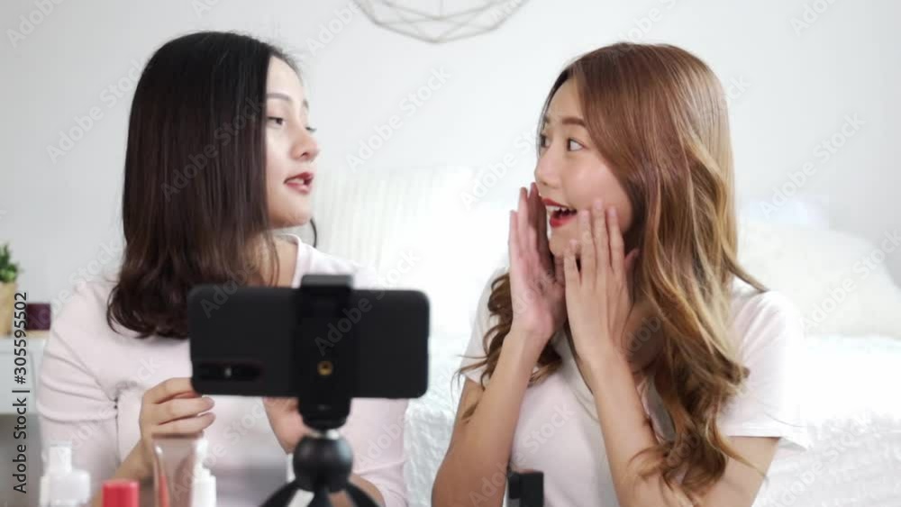 Portrait of young asian woman review giveaway gift product fan following channel, recording video make up lipstic cosmetic at home. Beauty blogger present beauty cosmetics Portrait of young asian woman review giveaway gift product fan following channel, recording video make up lipstic cosmetic at home. Beauty blogger present beauty cosmetics