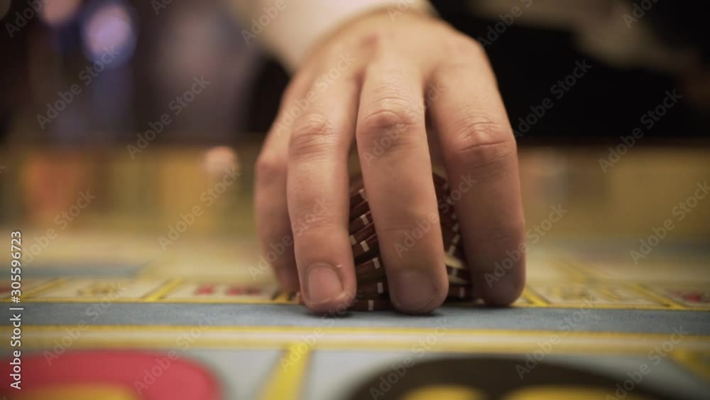 roulette playing with chips, close up chips in casino, close up hands of croupier roulette playing with chips, close up chips in casino, close up hands of croupier