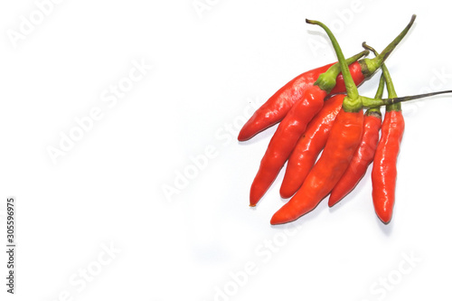 Closeup fresh red orange chili pepper with clipping path isolated on white background. Close-up red orange chilli pepper on a white background