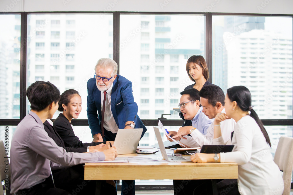 Successful Business team Meeting at meeting room in office, businessman  owner holding papers coworkers making great business discussion ,Teamwork training business success