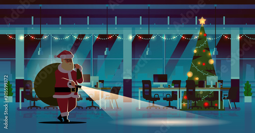 santa claus with gifts sack using flashlight christmas new year holidays celebration concept modern night decorated office interior full length horizontal flat vector illustration