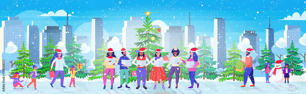 people with sheet books giving performance merry christmas happy new year holidays celebration concept mix race men women standing near fir tree modern cityscape background full length horizontal people with sheet books giving performance merry christmas happy new year holidays celebration concept mix race men women standing near fir tree modern cityscape background full length horizontal