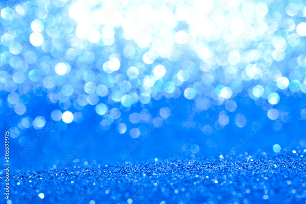 sparkles of blue glitter abstract background	