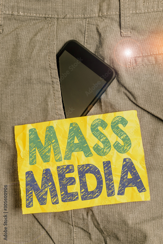 Obraz premium Writing note showing Mass Media. Business concept for Group showing making news to the public of what is happening Smartphone device inside trousers front pocket note paper