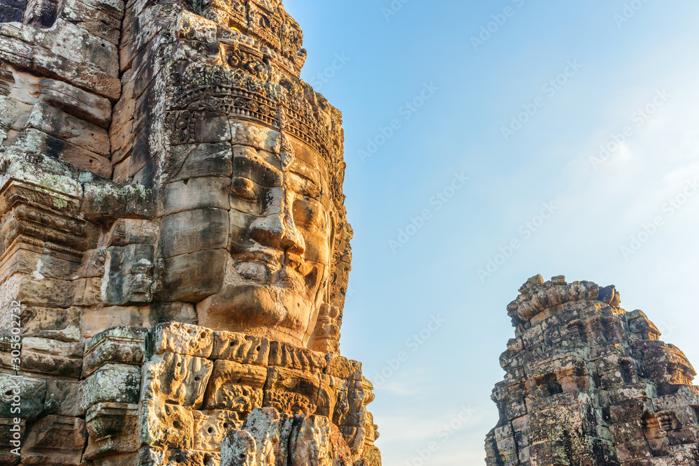Wonderful view of giant stone face of Bayon temple, Angkor