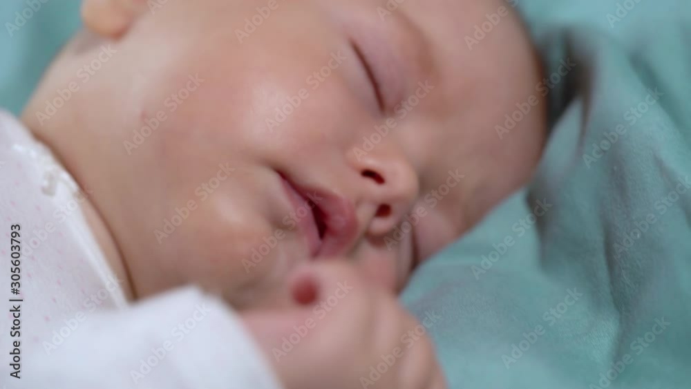 Calm infant sleeping in bed, healthy baby feeling safe secure at home, adoption Calm infant sleeping in bed, healthy baby feeling safe secure at home, adoption