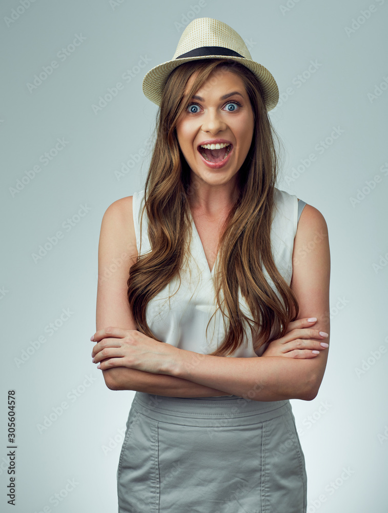woman dressed casual with hat posing with crossed arms. woman dressed casual with hat posing with crossed arms.