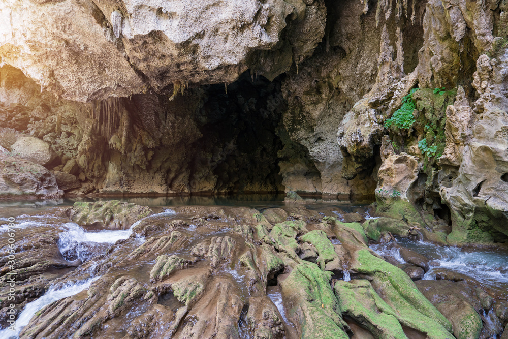 Tourists enjoy adventure in Lam Khlong Ngu cave at National Park Kanchanaburi Thailand