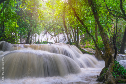 Waterfall scene at Pha Tad Waterfalls in rainforest at the Khuean Srinagarindra National Park Kanchanaburi.