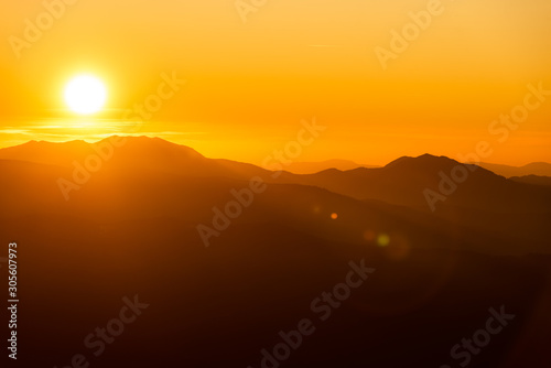 Mountains in sunrise,fog on sunrise,mist over mountain during sunrise © dvv1989