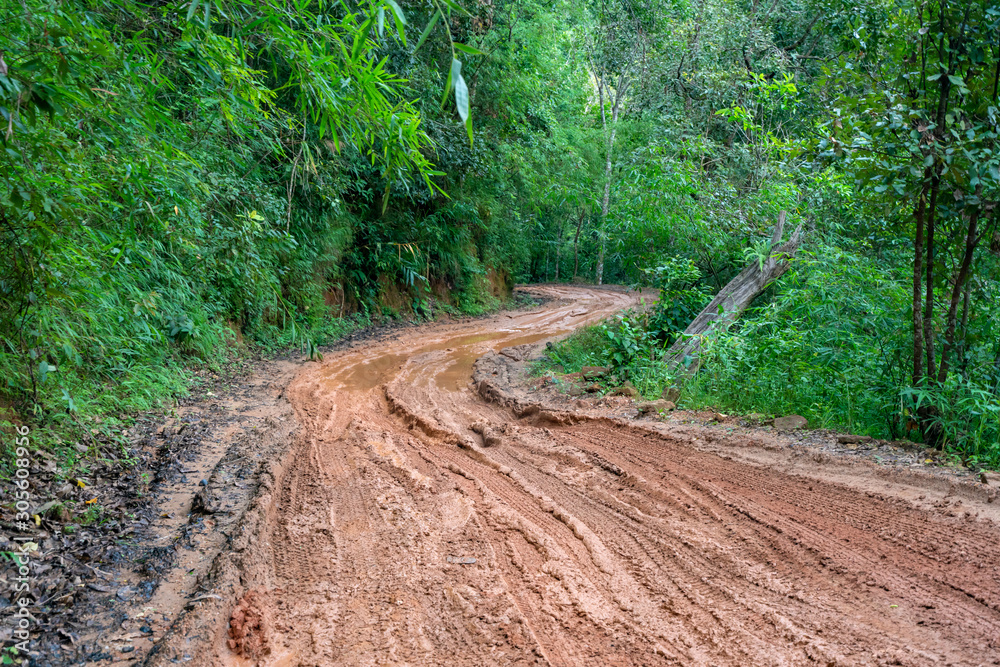 road wet muddy of backcountry countryside in rainy day