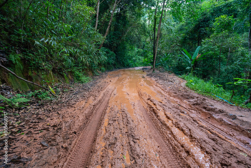 road wet muddy of backcountry countryside in rainy day