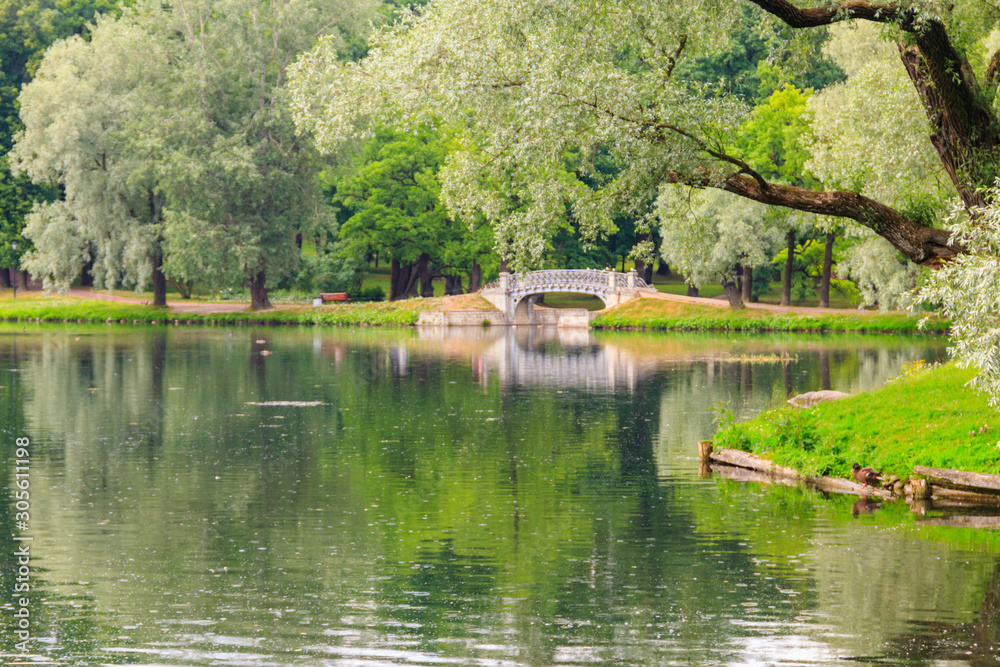 Lake with old bridge in a park in Gatchina, Russia