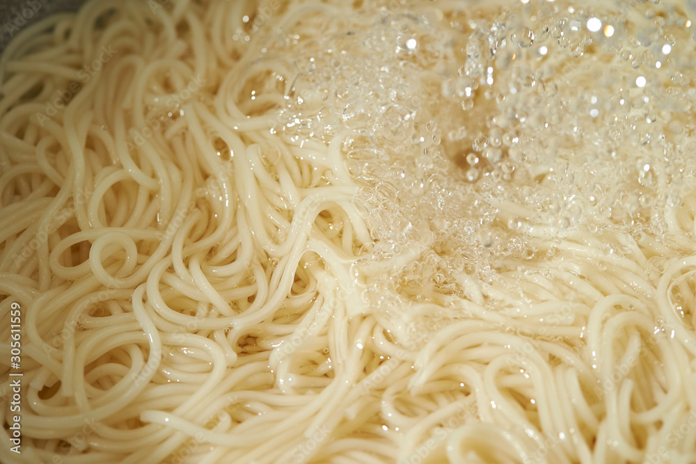 Washing boiled somen noodle with cold water Washing boiled somen noodle with cold water