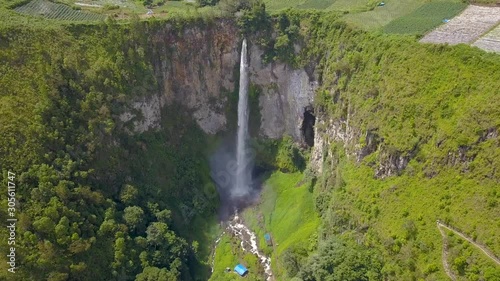 Aerial view of the highest waterfall in Indonesia known as Sipiso Piso Waterfall, located in Lake Toba.