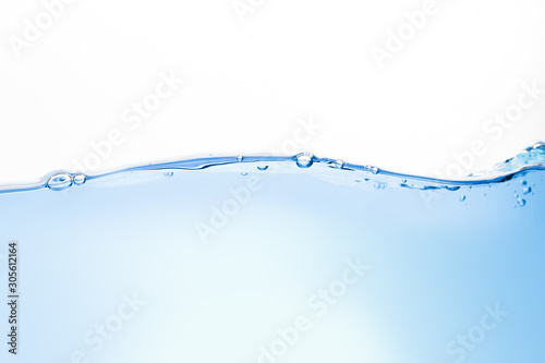 Close-up of blue water waves and bubbles on a white background.