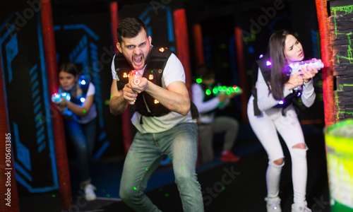 Young man on laser tag arena