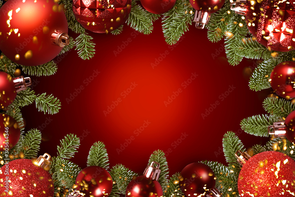 Red Christmas Baubles With Green Fir Branches On Red Background