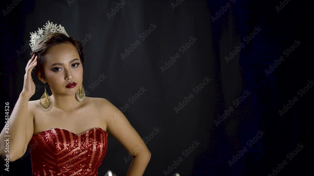 Beauty pageant winner looks at the camera as she wears her royal, diamond jewel crown - copy space Beauty pageant winner looks at the camera as she wears her royal, diamond jewel crown - copy space