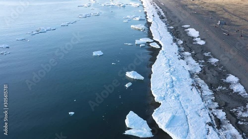 The sea coastal strip covered with ice and snow. Place of shooting northerly coast of the Bering Sea, Chukchi region, Russia.