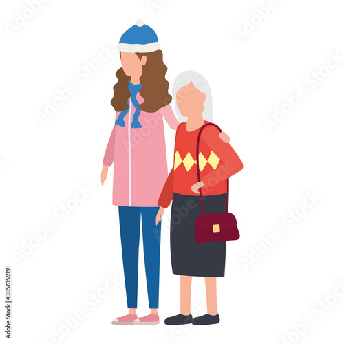 cute grandmother with daughter using christmas hat