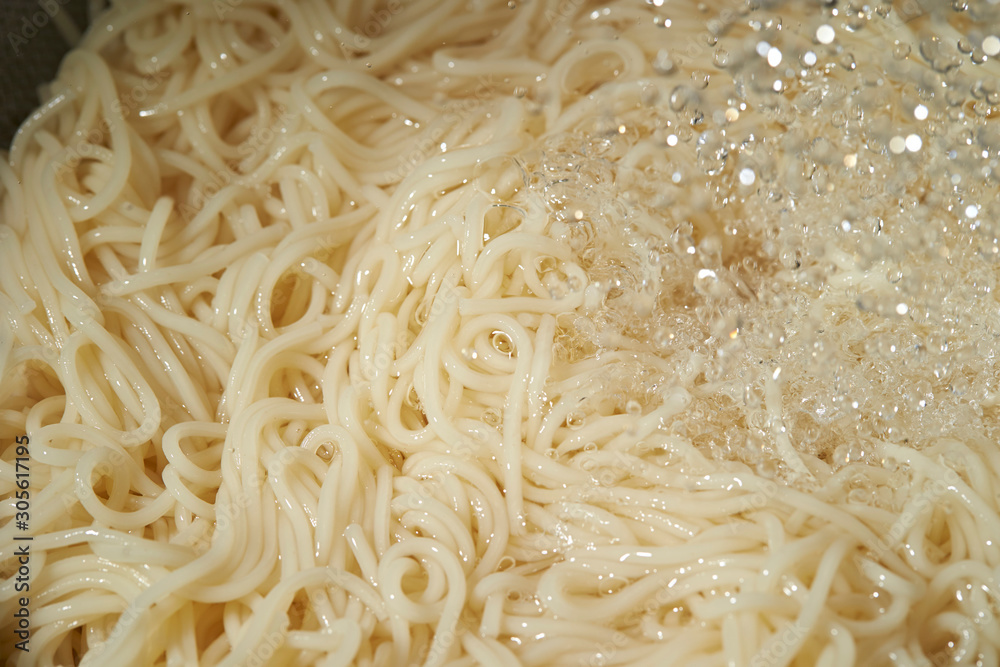 Washing boiled somen noodle with cold water Washing boiled somen noodle with cold water