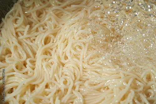 Washing boiled somen noodle with cold water 