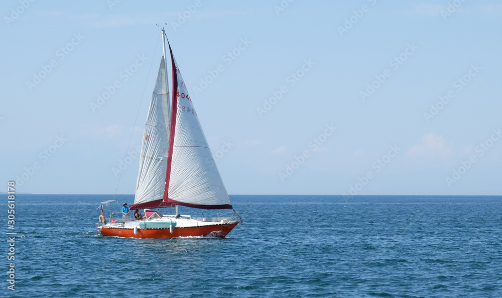 sea view with a sailing boat