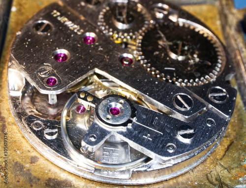 Old clock mechanism close-up . Vintage mechanical watch. Macro image. 