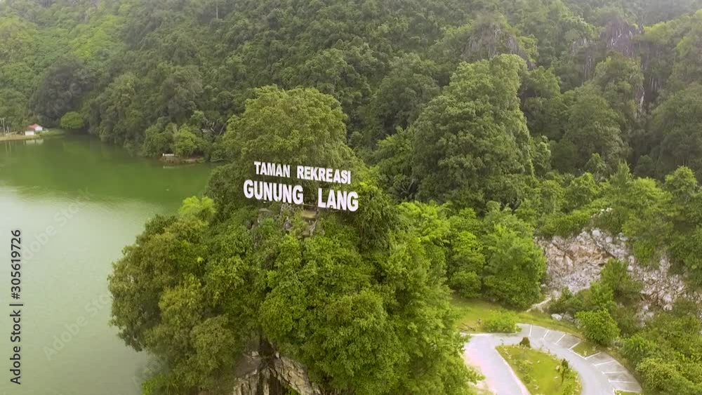 Aerial view of a public park known as Gunung Lang in Perak state in Malaysia. Aerial view of a public park known as Gunung Lang in Perak state in Malaysia.