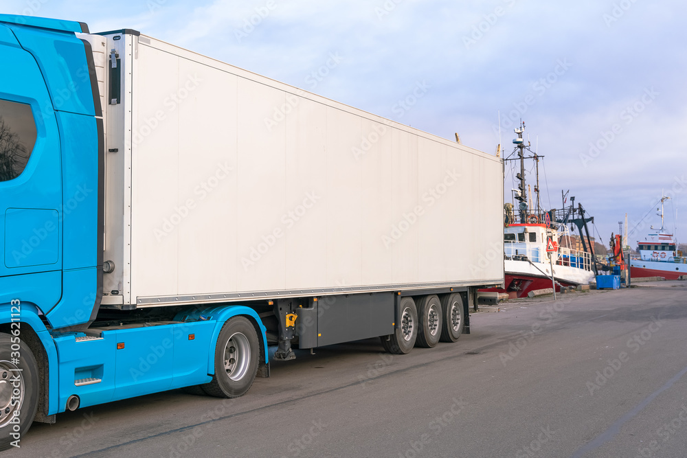 blue truck delivery commercial cargo with refrigerator trailer. Copy space.