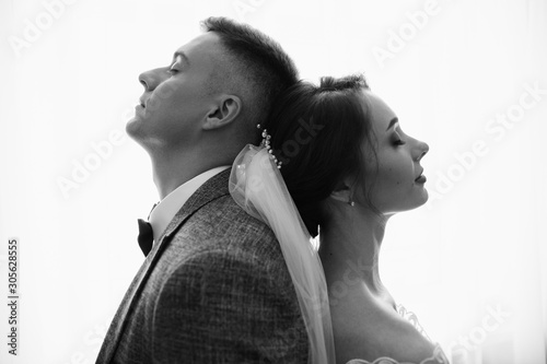 Marriage and wedding. Silhouette of newlywed couple, black and white portrait of bride and groom