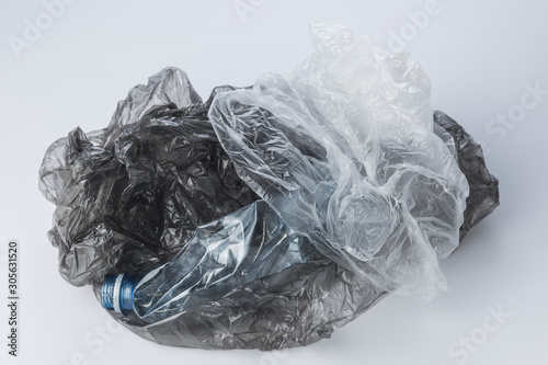 Plastic bags and crumpled bottles