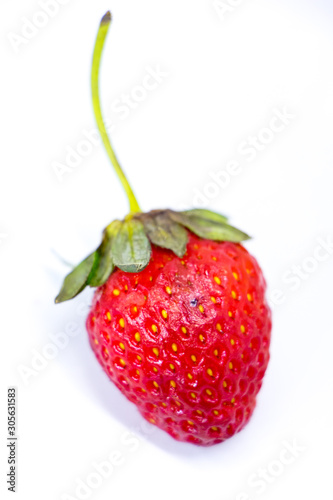 Isolated single strawberry.