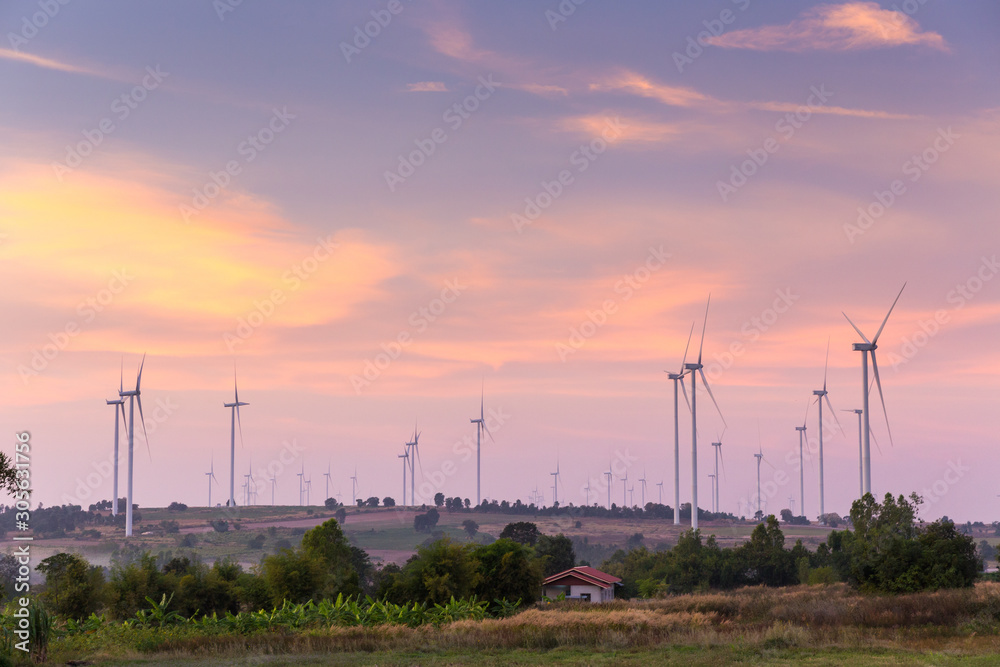 Obraz premium Wind turbine power generator at twilight