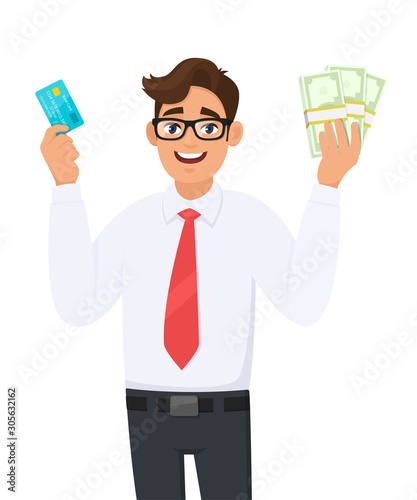 smiling young businessman showing credit, debit, ATM card. Person holding bunch of cash, money, currency notes in hand. Male character design illustration. Modern lifestyle concept in vector cartoon.