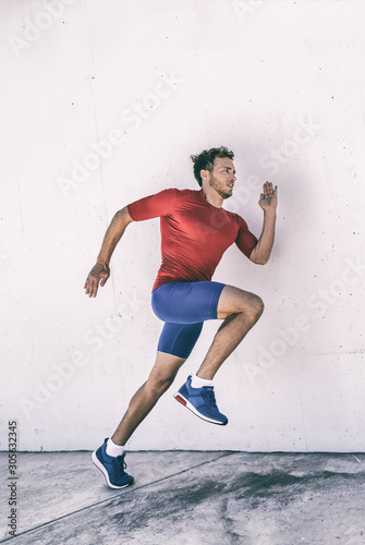 Run athlete runner man running jumping explosive dynamic stretching plyo workout training glutes and body muscles for hiit exercise.