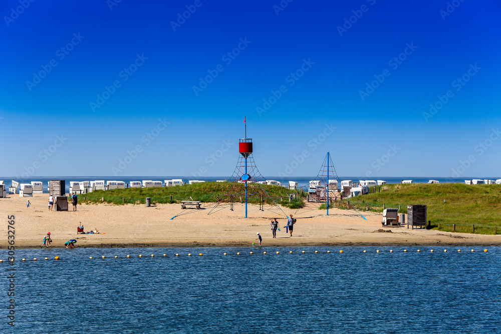 Fototapeta premium View of the beach area of the family lagoon Perlebucht, Büsum, North Sea, Germany