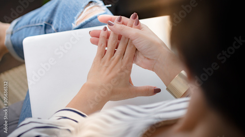 Bilde på lerret Closeup of a working woman's hands, she straighten her fingers that gets stiffness in the morning from trigger finger disease (locking finger or stenosing tenosynovitis)