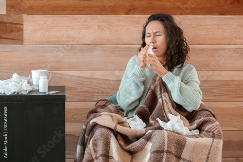 Woman ill with flu at home