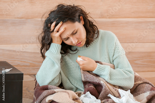 Woman ill with flu at home
