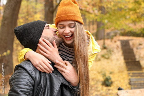 Happy young couple embracin...