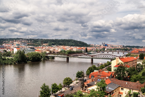 Aerial view of Praha (Prague), Czech. Prague is colorful and beautiful European city.Beautiful view of the architecture of Prague and bridge over river Vltava in the Czech. Dramatic sky background.