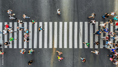 Aerial. Pedestrians on a zebra crosswalk. Top view.