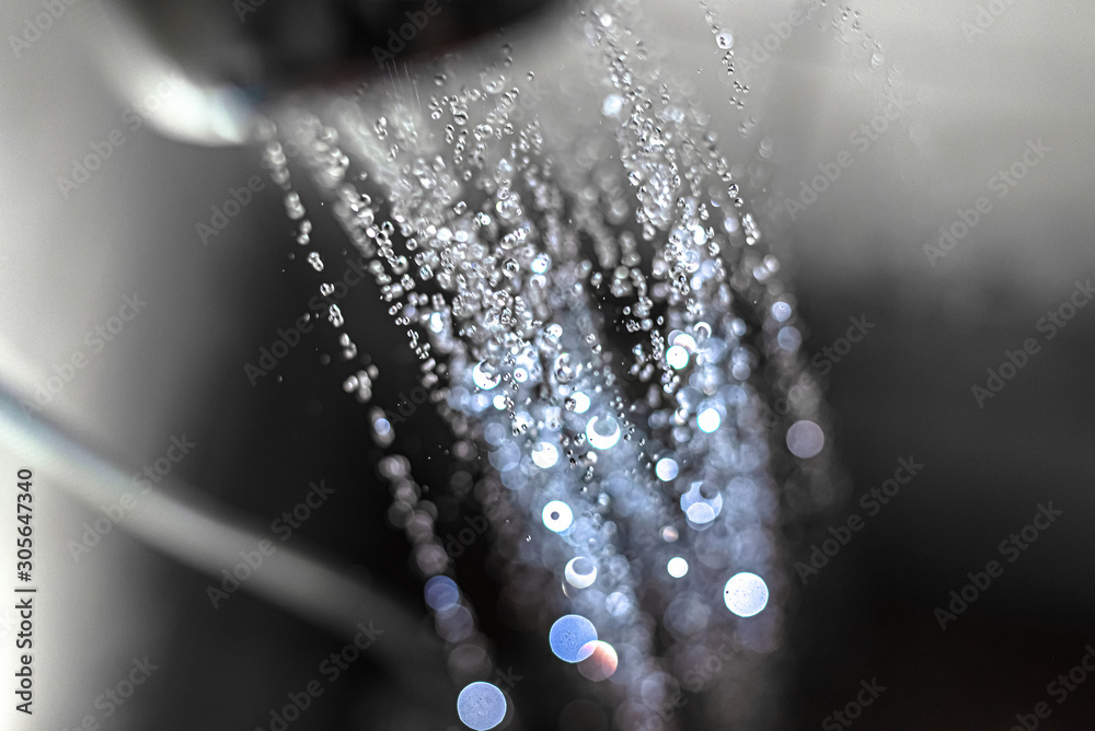 Closeup of water drops running  from the shower head in the bathroom - obrazy, fototapety, plakaty 