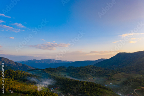 Aerial landscape with sunrise in the morning located in Maehongsan province, Thailand. © Panwasin