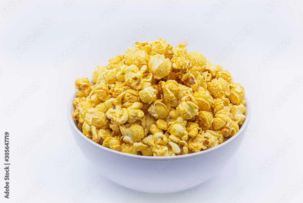 Delicious popcorn with caramel in bowl on.white color background